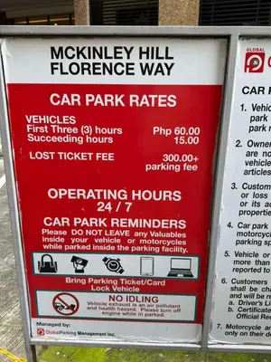 a sign that says car park rates on a parking meter at Stamford Residences Fully-furnished in Manila
