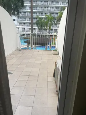 a view of a tile floor from a balcony at 1bedroom pool view with big balcony in Manila