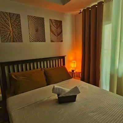 a bedroom with a bed with a box on it at Azure Urban Resort Residences by Moldez Staycation in Manila