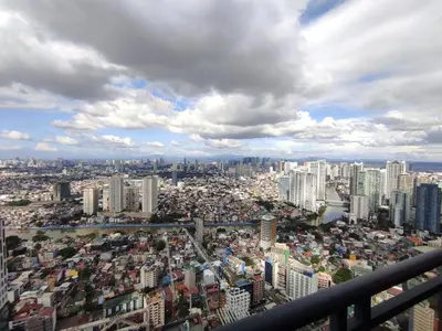 a view of a large city with many buildings at Cozy Apartment City & Mountain View with balcony FREE use of pools sauna and sunbathing in Manila