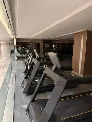 a row of treadmills in a gym at Unistay SHORE 3 Poolview w Balcony in Manila