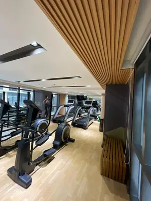 a gym with treadmills and elliptical machines at 1BR Executive Suite Beside Okada & Solaire - 4pax in Manila