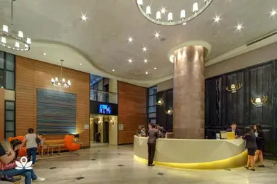 a lobby with a reception desk in a building at David Gelber in Manila