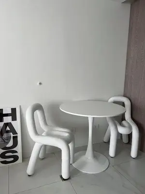 a table and two chairs and a white table and chairs at Cloud Space Studio near Eastwood in Manila