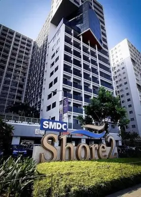 a large sign in front of a large building at Staycation at Shore 2 Residences Tower 1 Near Moa, PICC, STARCITY, WORLD TRADE, SMX, MOA ARENA & NAIA 123 in Manila