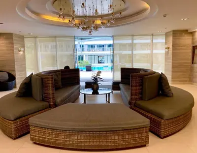 a living room with two couches and a table at CityHomeStay in Manila