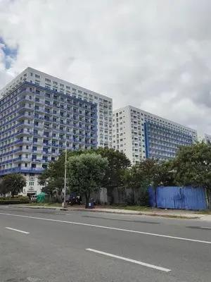 a large building on the side of a road at Sea Residence Finest By Douie in Manila