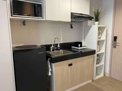 a small kitchen with a sink and a microwave at Condo unit near SM City Sta Rosa unit 3 in Santa Rosa