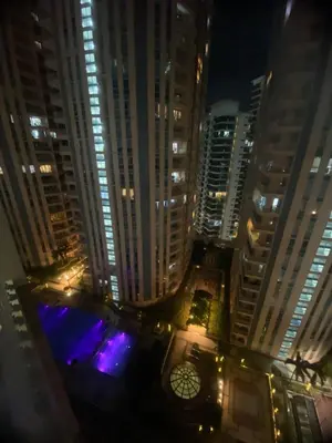 a view of a city at night with lights at The Serene Casa - EMANUELE TOWER in Manila