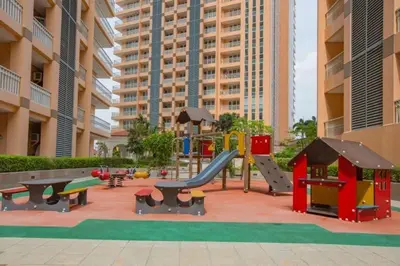 a playground with play equipment in a building at The Serene Casa - EMANUELE TOWER in Manila