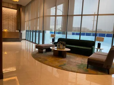 a lobby with a couch and a table and chairs at 2mins to Okada near Airport & MOA with Balcony-8E in Manila