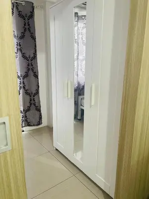 a door with a mirror in a room at Shore 1 Condo near MOA - PLS send valid IDs of all guests after booking for guest authorization form purposes in Manila