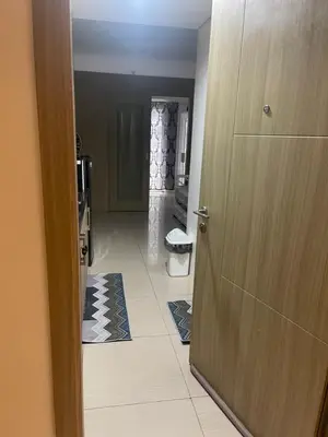 a door leading to a room with a kitchen at Shore 1 Condo near MOA - PLS send valid IDs of all guests after booking for guest authorization form purposes in Manila