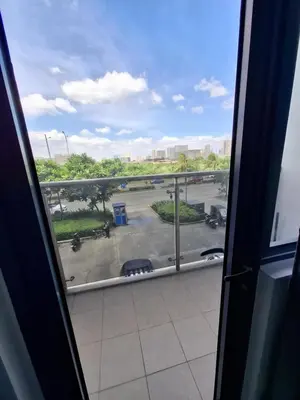 a view from a window of a parking lot at Shore 2 Residences MOA Pasay Naia in Manila