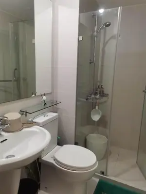 a bathroom with a toilet and a sink and a shower at Azure Urban Resort Residences - Staycationary Miami 1710 in Manila