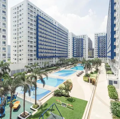 an aerial view of a resort with a swimming pool at Suite Escapade in Manila