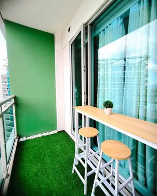 a small balcony with two stools and a bar at Azure Urban Resort Residences by Staycationary 17th floor Miami in Manila