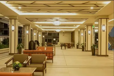 a lobby of a hospital with tables and chairs at Stylish & Spacious Place Near BGC Fast Wi-Fi in Manila
