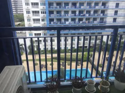a balcony with a view of a building at Arcilla stay cation in Manila