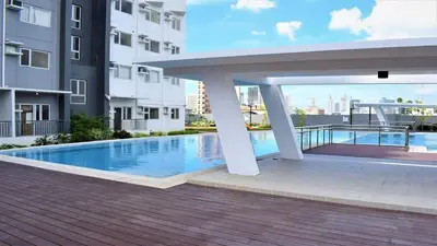 a swimming pool in the middle of a building at Avida Towers Intima Paco, Manila Studio Unit in Manila