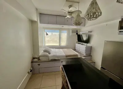a small kitchen with a bed in a room at Avida Towers Intima Paco, Manila Studio Unit in Manila