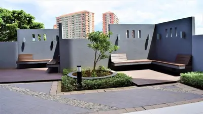 two benches in a courtyard with a building at Avida Towers Intima Paco, Manila Studio Unit in Manila