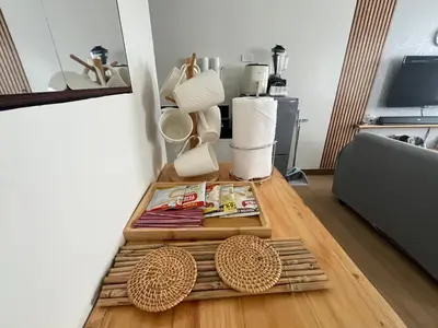 a room with a table with books and baskets at Aras Solace Place in Trece Martires