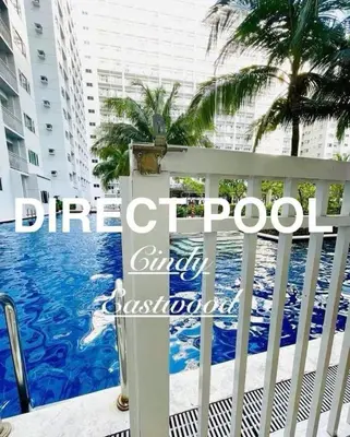 a view of the pool from the balcony of a building at SMDC Shore Residences in Manila