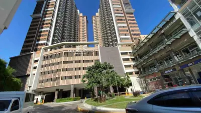 a group of tall buildings in a city at The Radiance Manila Bay by Mary in Manila