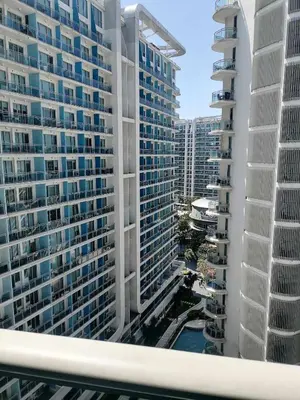 a view from a balcony of tall buildings at Premium 1Bedroom Condo Unit Near Airport, MOA, Casinos, SM Bicutan in Manila