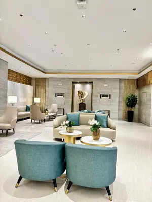 a lobby with couches and tables and chairs at Serenitude Staycation by Khaila - Fame Residences in Manila
