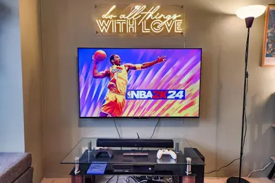 a tv screen with a basketball player on it at Artsy 110sqm 2br in MOA 200mbps Wifi XBOX Printer in Manila