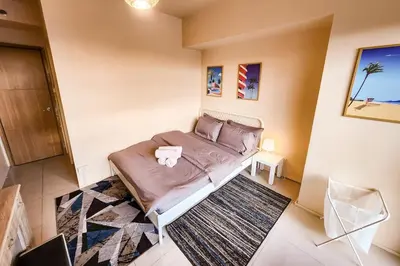 a bedroom with a bed in a room at Amazing View 2br MOA, 98 sqm XBOX 200mbps, Printer in Manila