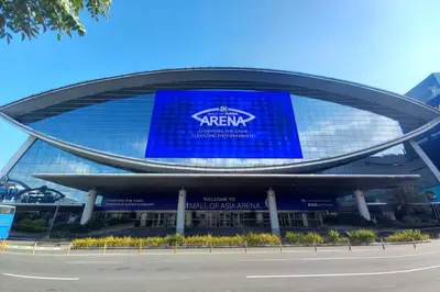 a large building with a sign in front of it at Lush 2br 98sqm MOA 200mbps Netflix XBOX Printer in Manila