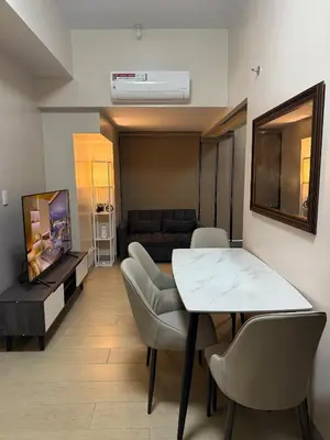 a living room with a table and a couch at Superior Studio Eastwood Global Plaza Luxury Residence in Manila