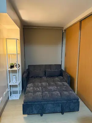 a bedroom with a large bed in a room at Superior Studio Eastwood Global Plaza Luxury Residence in Manila