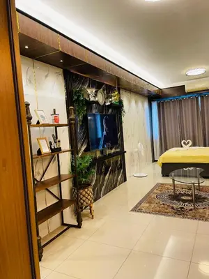 a room with a bed and a tv in a room at Shell Residences with MOA View near NAIA - Aiza's Place in Manila
