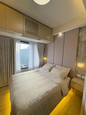 a bedroom with a large bed and a large window at 1LDK Air Studio in Makati City in Manila