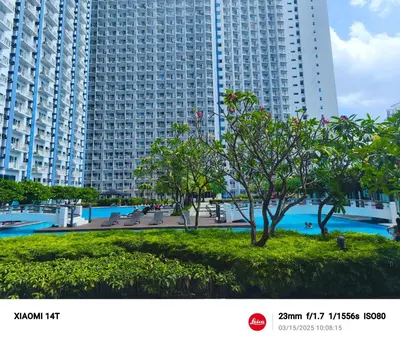 a view of a large building with trees in front at City Staycation Condo-SM Jazz in Manila