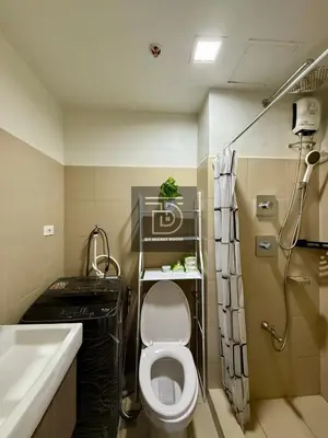 a bathroom with a toilet and a sink and a shower at Shore 3 Tower 1 Condo staycation near MOA - DT in Manila