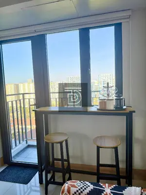 a bar in a room with a view of the city at Shore 3 Tower 1 Condo staycation near MOA - DT in Manila