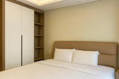 a bedroom with a bed and a book shelf at City Center Executive Hotel-Near Manila Airport and PITX in Manila