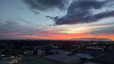 a view of a city at sunset at Aerith's Haven Azurecation in Manila