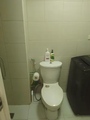 a bathroom with a toilet with two bottles on it at Staycation sa Jazz by Amaya 3921 Tower B in Manila