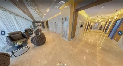 a lobby with a couch and chairs and a table at MOA Staycation at Shore 3 Residences Tower 1 in Manila