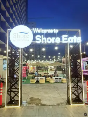 a welcome to shoppers ends sign in front of a store at MOA Staycation at Shore 3 Residences Tower 1 in Manila