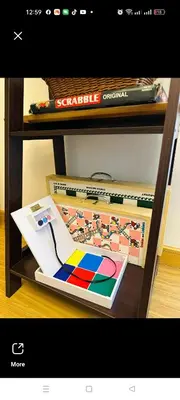 a shelf with a book and other items on it at Azure staycation by marco in Manila