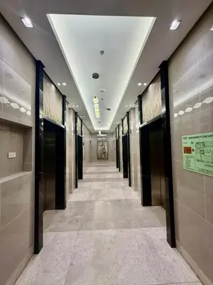 a hallway of elevators in a building at MJM Cityscape at Red Residences in Manila