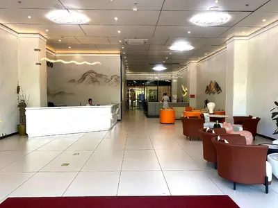 a lobby of a restaurant with tables and chairs at City Center Executive Hotel Manila Near Airport, PITX, Solaire, City of Dreams, Okada & Ayala Mall in Manila