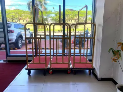a trolley with red seats in front of a window at City Center Executive Hotel Manila Near Airport, PITX, Solaire, City of Dreams, Okada & Ayala Mall in Manila